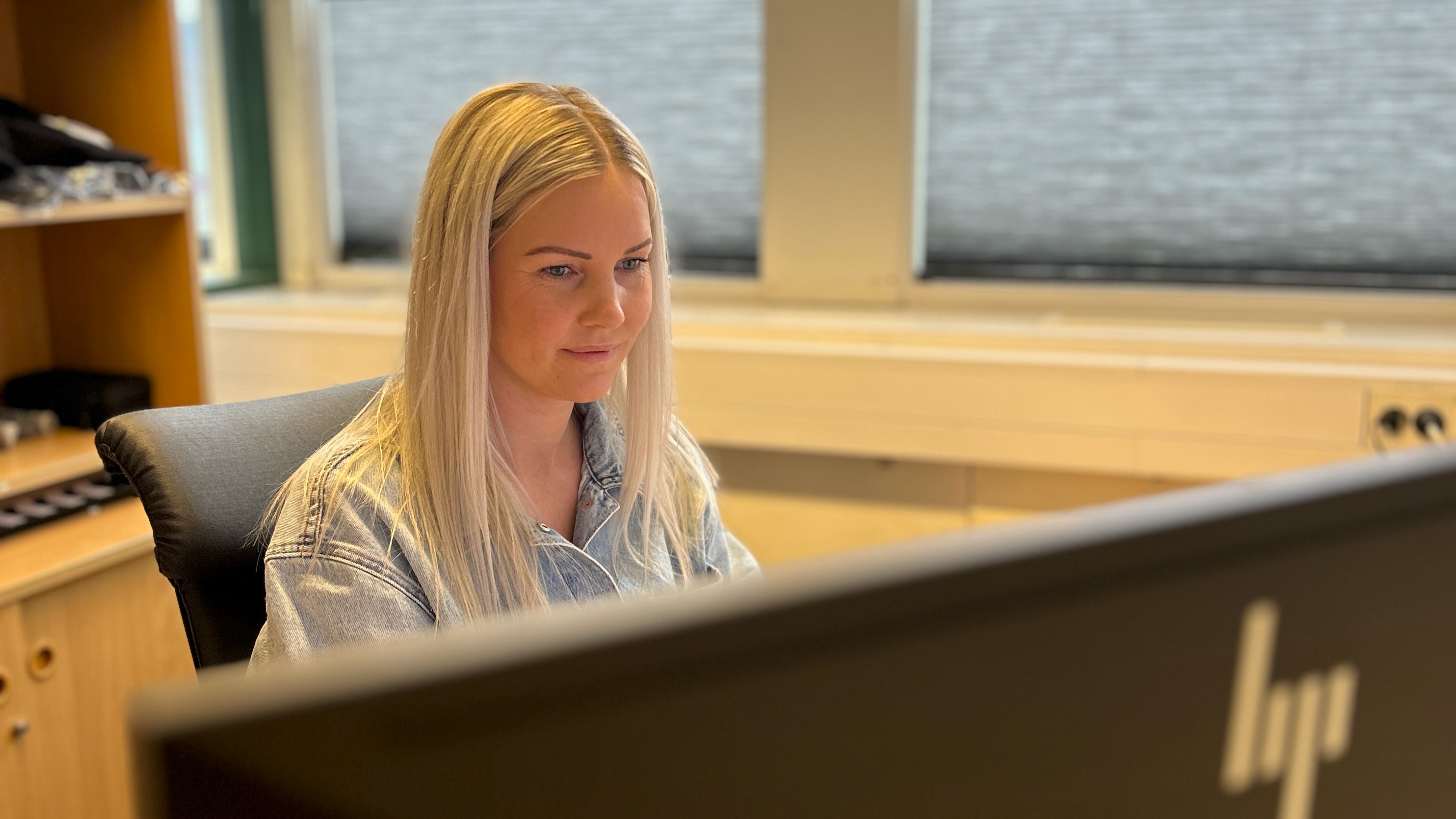 a woman sitting at a desk